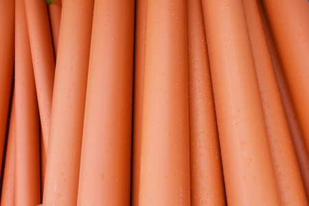 Large orange plastic pipes for sewerage system.の写真素材