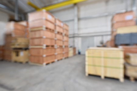 Beautiful blurred background in a warehouse with wooden boxes.の写真素材