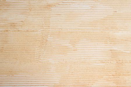 Textured covering of the beige wall. Horizontal line. Rough wall.