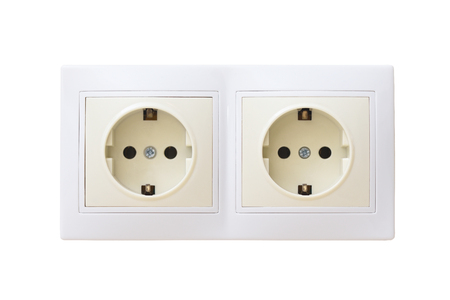 Two electric sockets. Two electrical outlets are beige and white paired. Isolated. Double.