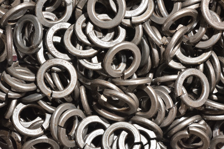 Texture set of metal washers for the assembly of products in the factory. Close Up