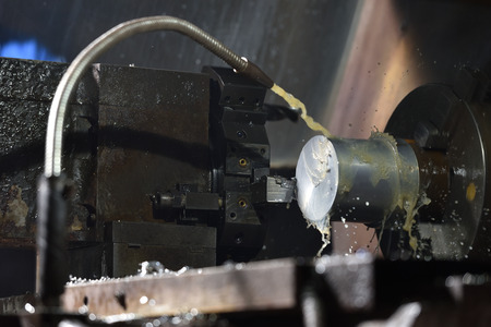 Spindle chuck and installed metal part in pocessing on high precision Cnc industrial lathe turning...