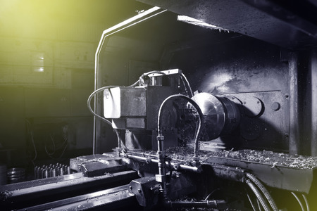 Spindle chuck and installed metal part in pocessing on high precision Cnc industrial lathe turning...