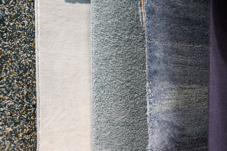 Different carpets of different colors for the bath or living room.の写真素材