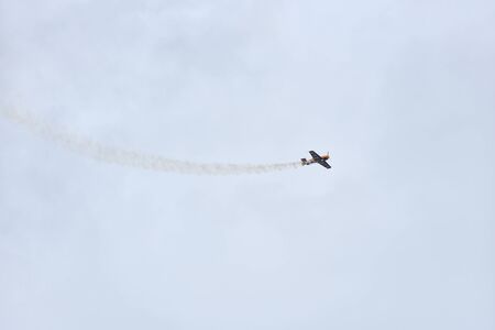 Gelendzhik, Russia - September 8, 2018: Light piston aircraft flies during an air show in a beautiful sky with cloudsのeditorial素材