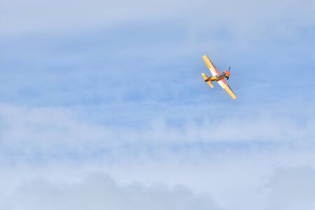 Gelendzhik, Russia - September 8, 2018: Light piston aircraft flies during an air show in a beautiful sky with cloudsのeditorial素材