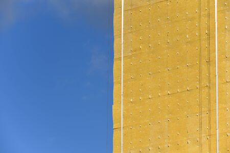 Construction of a residential building and insulation of its external wall with special...