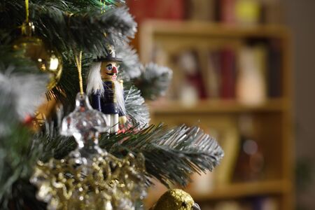 Nutcracker decoration hanging on a Christmas tree