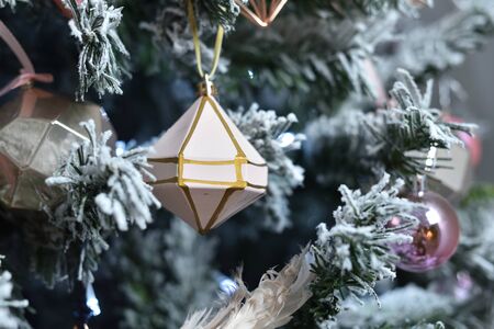 Crystal geometric shape ornament hanging on a Christmas treeの写真素材