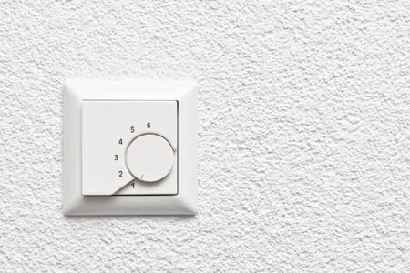 Wall-mounted temperature controller with adjustment wheelの写真素材
