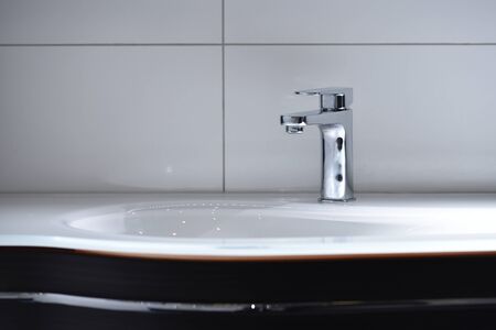 Chrome tap and new white drop-shaped sink