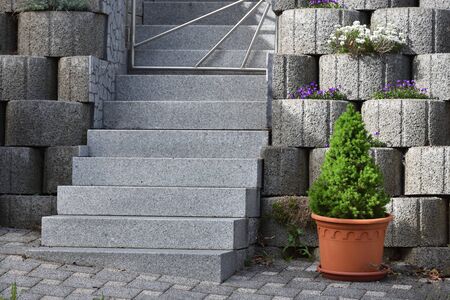 Garden staircase made of natural granite and a wall made of expanded clay concrete ringsの写真素材