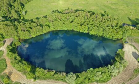 Aerial view of the river in the form of an eye with reflection of the sky.の写真素材