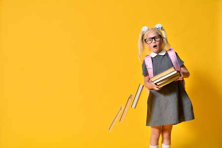 Primary school girl tired of studying and dropped her books