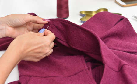 Dressmaker sews clothes to order, making clothes
