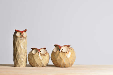 Set of empty vases in the shape of an owl on a gray background
