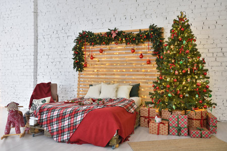 Christmas bedroom interior on a brick wall backgroundの写真素材