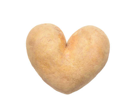 Heart shaped potato on white isolated backgroundの写真素材