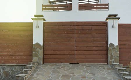 Brown wooden gate and fence