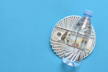 Plastic bottle lies on dollarsの写真素材