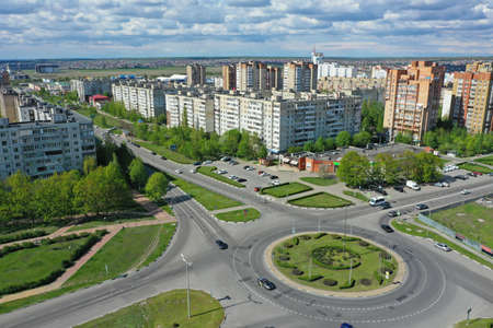 STARIY OSKOL, RUSSIA - MAY 12, 2021: Aerial view of the ring road and urban residential buildings