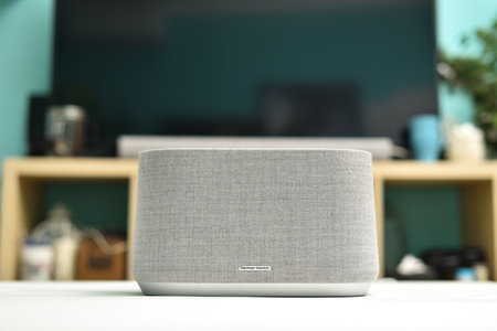 STARIY OSKOL, RUSSIA - MAY 19, 2021: Modern wireless bluetooth speaker Harman Kardon on the table in the interiorのeditorial素材