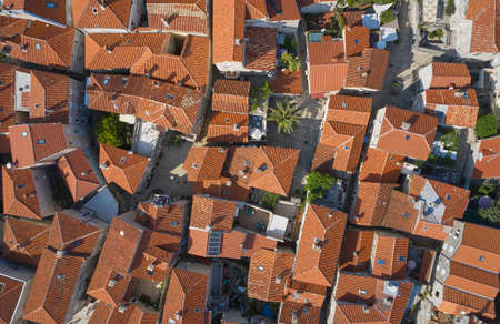 Top view of brown roofs of houses in the old town of Budva