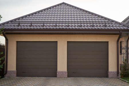 Private new garage with rolling gates for two carsの写真素材