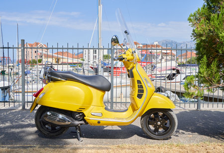cute yellow motor scooter in retro style.の写真素材