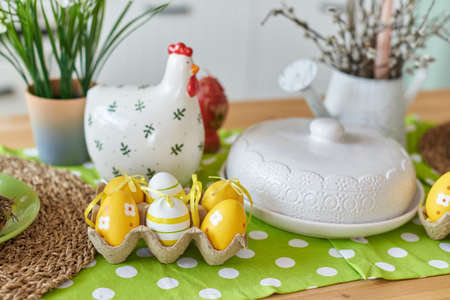 Easter table decoration in the kitchen with colored eggs.の写真素材