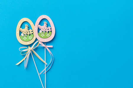 Easter decor in the form of wooden eggs on a stick.