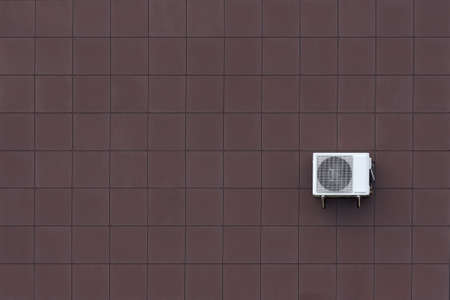 The wall of the building and compressor for air conditioning.の写真素材