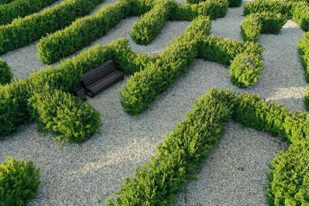 Aerial view of beautiful formal garden with benchの写真素材