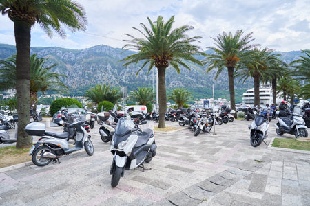 KOTOR, MONTENEGRO - JULY 19, 2021: Parked motorcycles on the sidewalkのeditorial素材