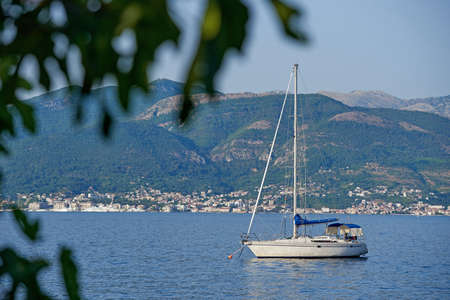 Small sail yacht is moored in Kotor bay, Montenegro