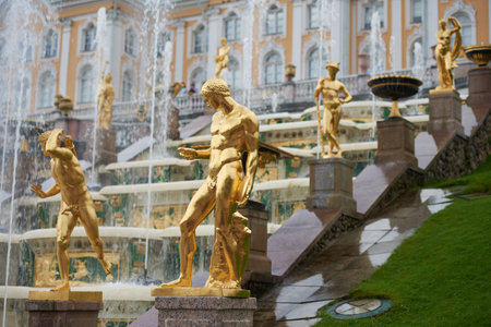 Golden statues at the fountain in Peterhofの写真素材