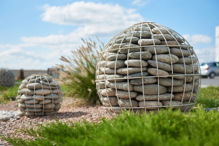 Pebble stone sphere for garden decorationの写真素材