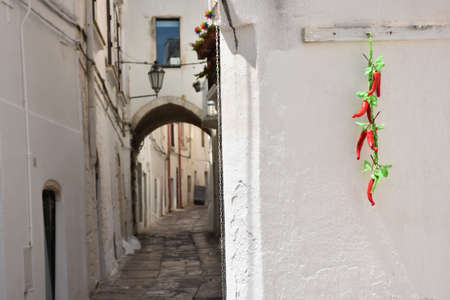 A characteristic alley in the historic center of Ostuni in Pugliaの写真素材