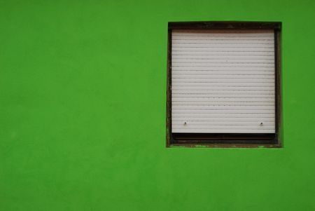 window over green wall