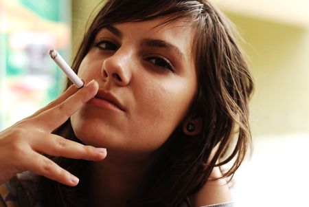 young woman smokingの写真素材