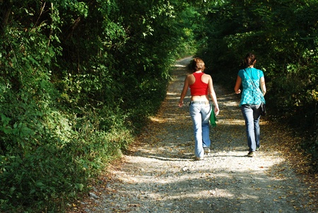   women walking in the forestの写真素材