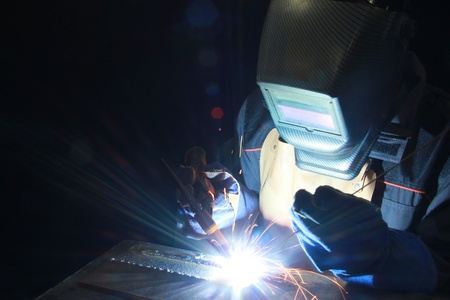 Welder at work in metal industryの写真素材