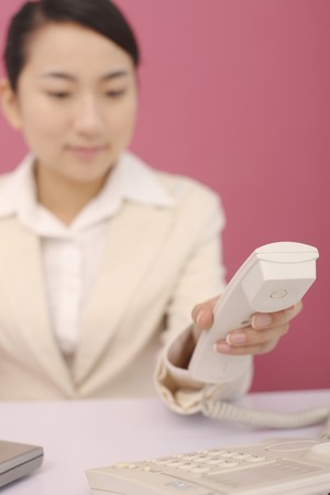 Woman about to make phone callの写真素材