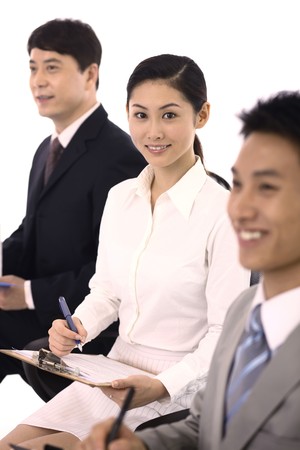 Business people writing reportの写真素材