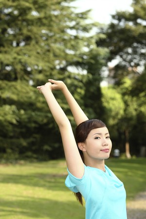 Woman stretching in the parkの写真素材