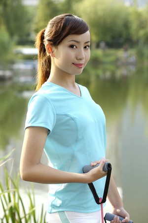 Woman using exercise bandの写真素材