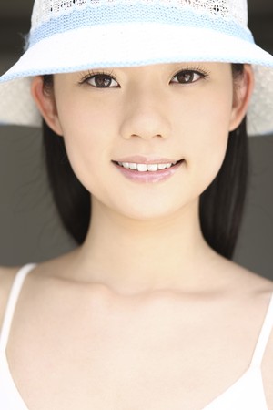 Woman smiling and posing for the cameraの写真素材