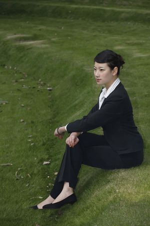 Businesswoman sitting outdoorsの写真素材