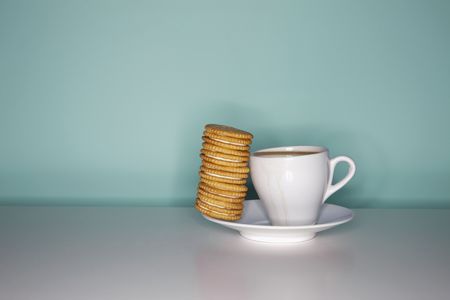 Coffee and a stack of biscuitsの写真素材