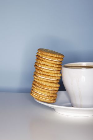 Coffee and a stack of biscuitsの写真素材